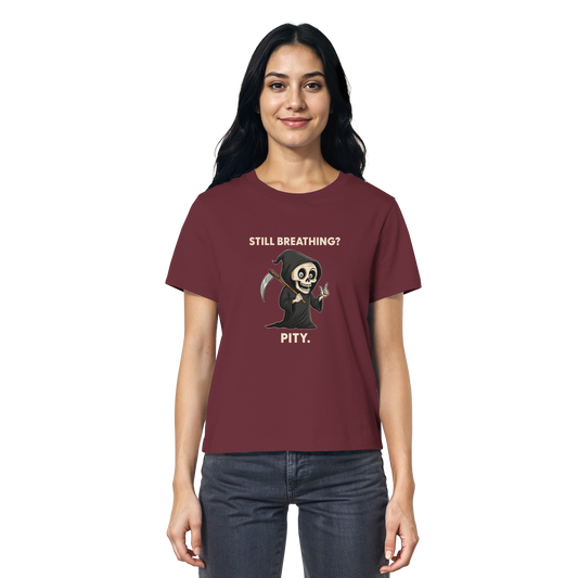 Woman wearing maroon organic shirt with grim reaper illustration and sarcastic phrase about still breathing