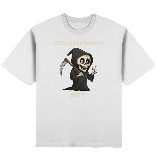 White oversized T-shirt with a cartoon grim reaper holding a scythe and text saying Still breathing? Pity.